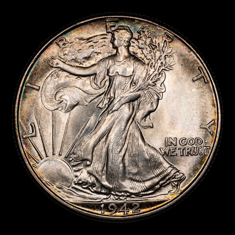 1942 Walking Liberty Half Dollar die strikethrough FS-901 showing irregular surface area where foreign material was trapped between die and planchet during striking